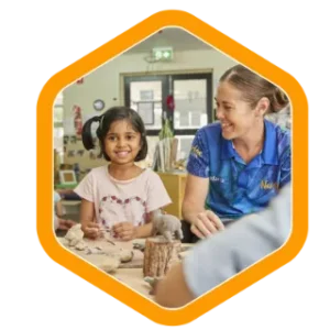 an indigenous ambrose early learning educator teaches a small indigenous girl